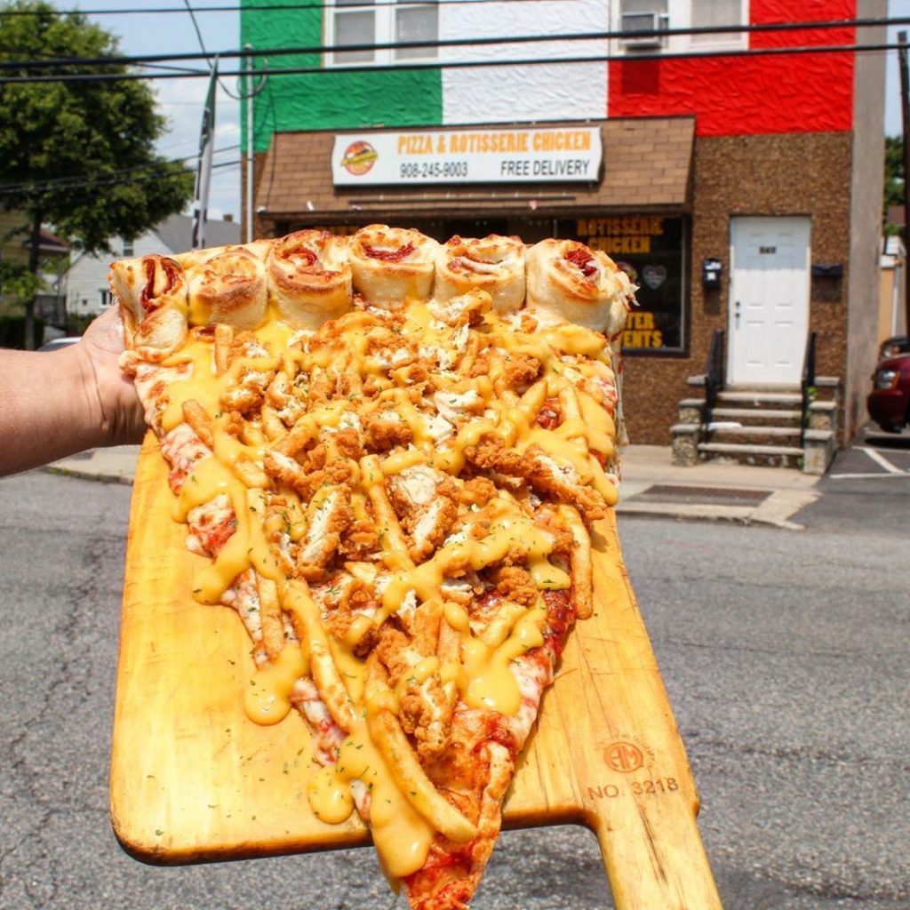 New Foodie Trend Is A Giant Pizza Slice – The Biggest You’ve Seen