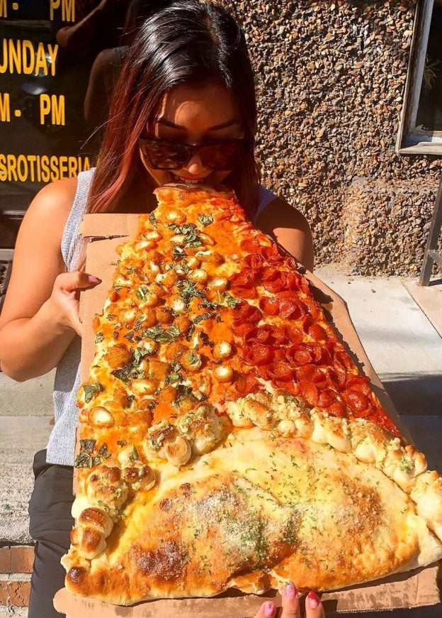 ≡ New Foodie Trend Is A Giant Pizza Slice The Biggest You've Seen