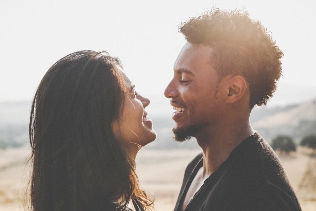 11 Universal Signs That Someone Is Flirting With You